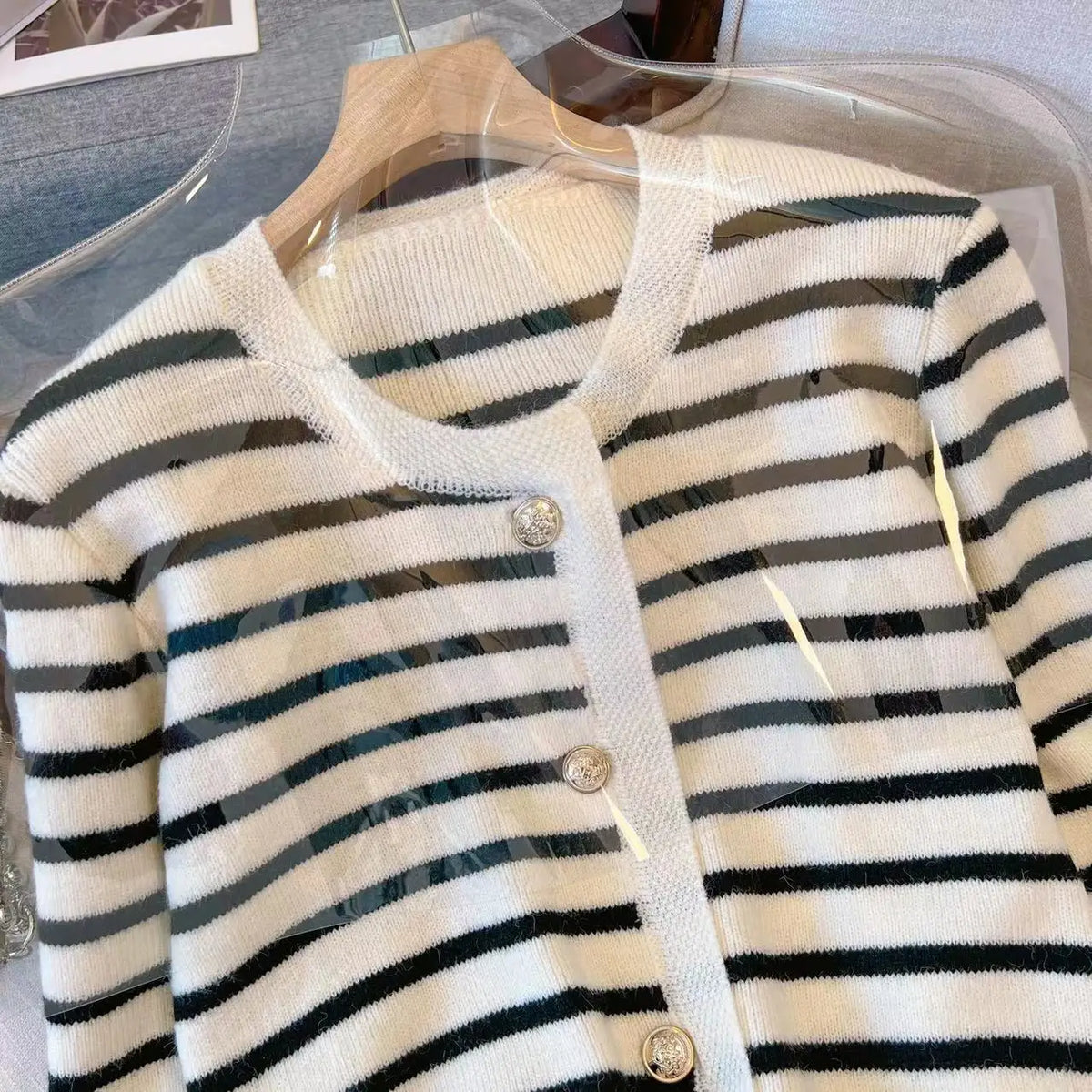 Striped cropped cardigan button closure detail