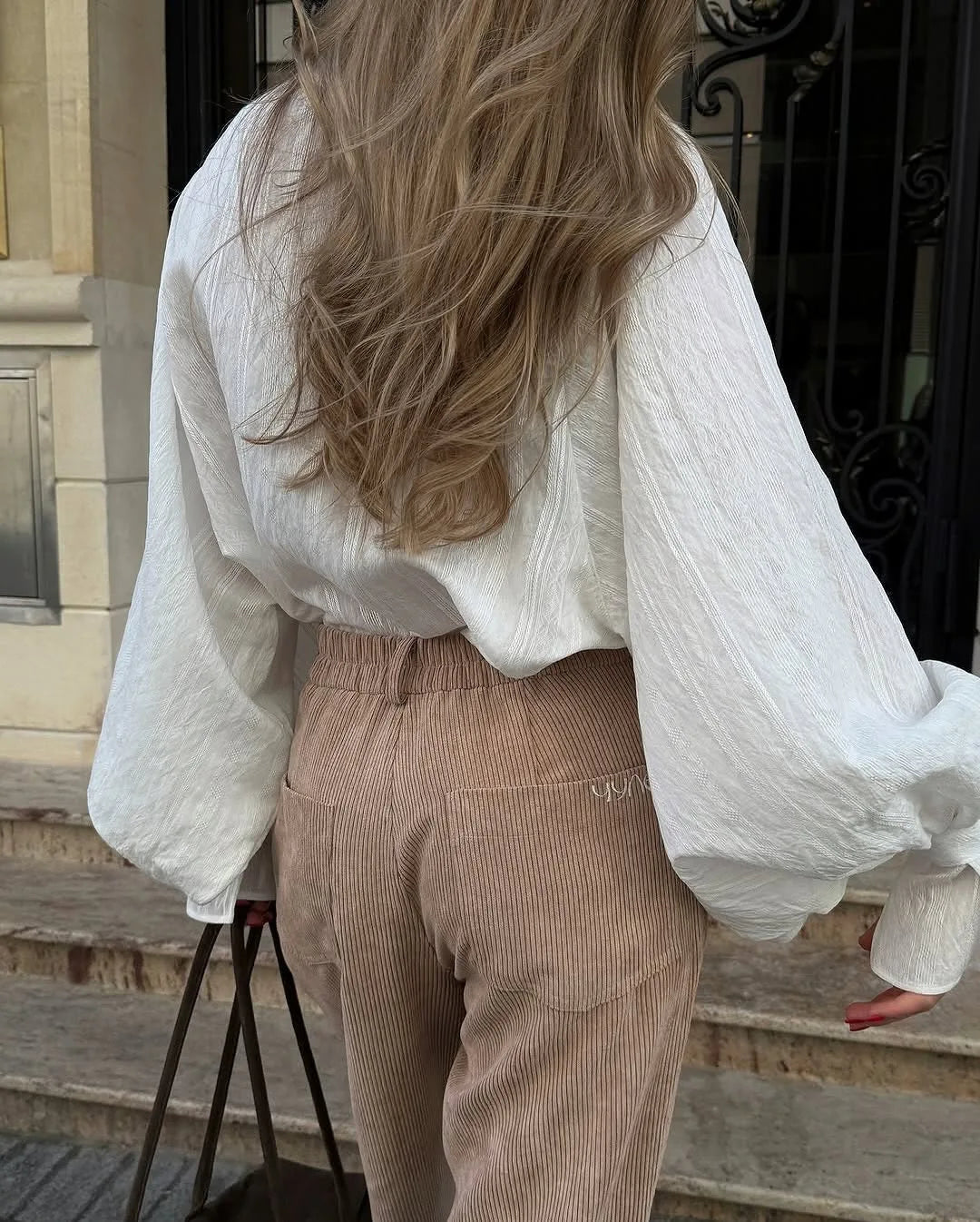 Women's oversized cotton button-up shirt worn as dress