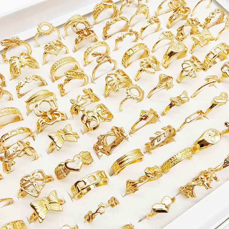 Assorted statement rings worn stacked on fingers