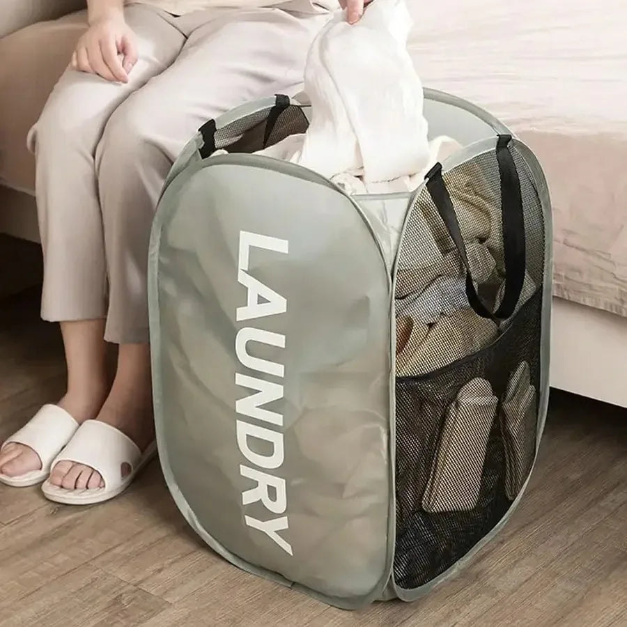 Foldable mesh laundry basket folded flat view