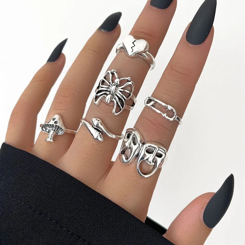 Assorted statement rings worn stacked on fingers