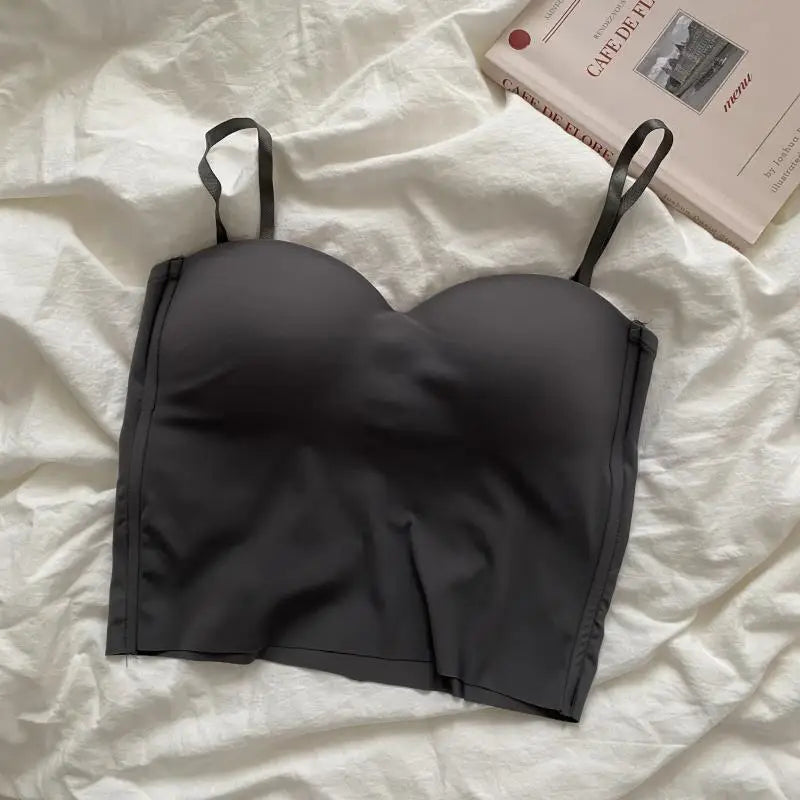 Seamless camisole with built-in cups black folded on fabric
