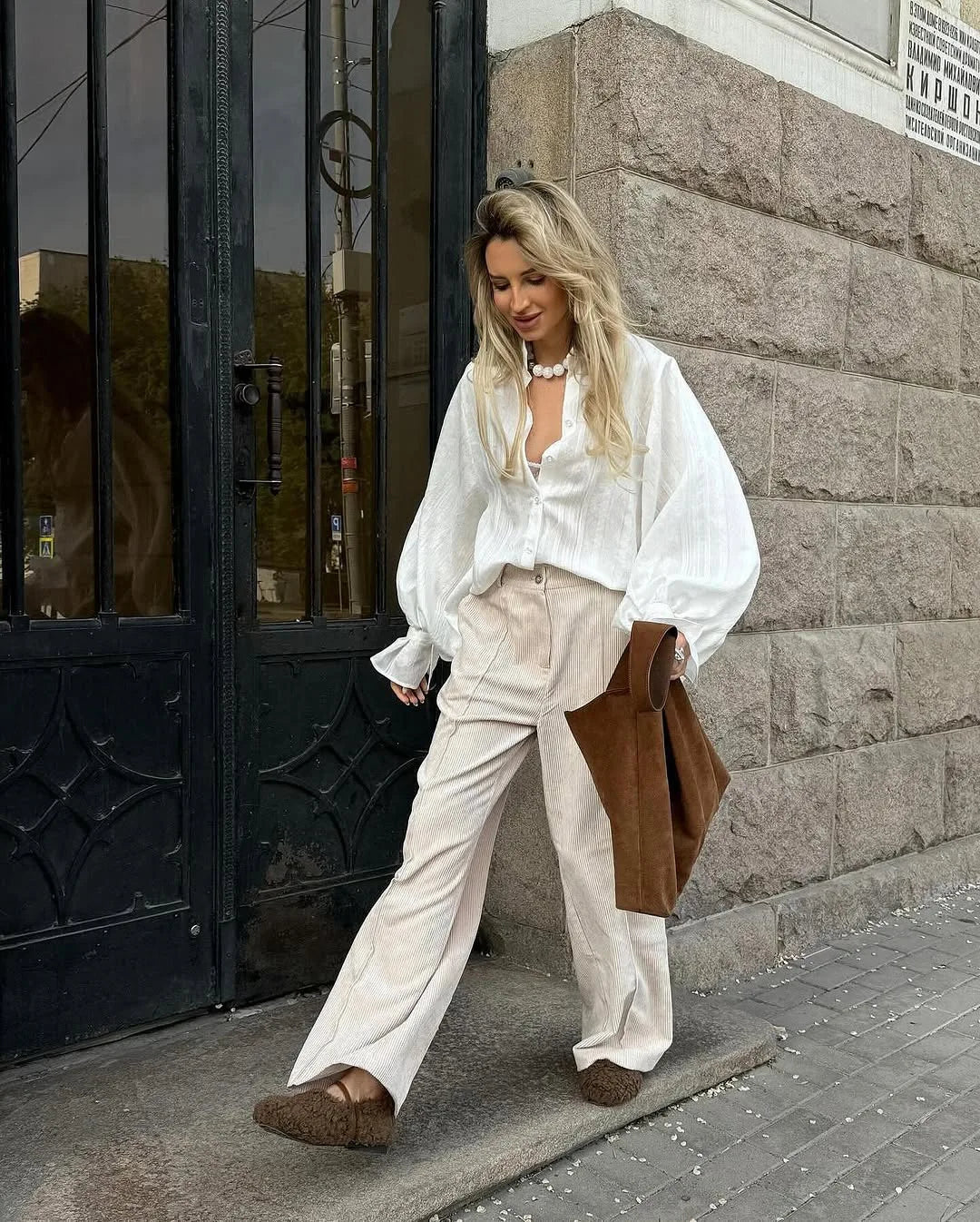 Women's oversized cotton button-up shirt worn as dress