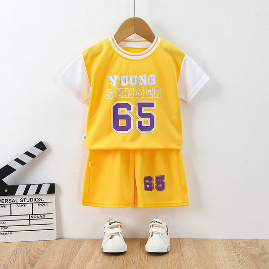 Boys basketball tee & shorts set worn by child