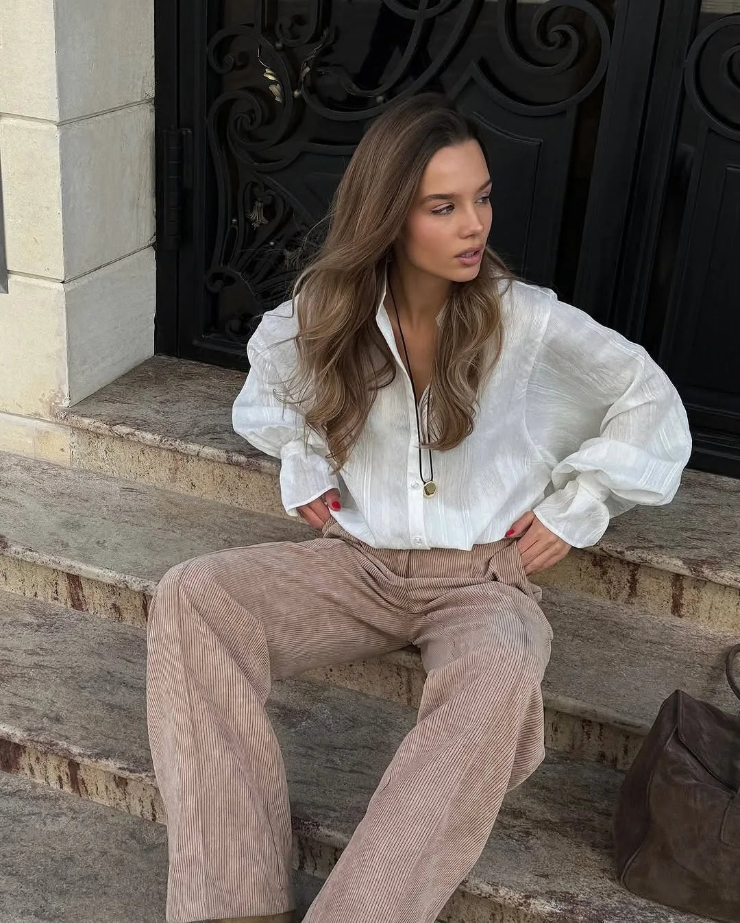 Women's oversized cotton button-up shirt worn as dress