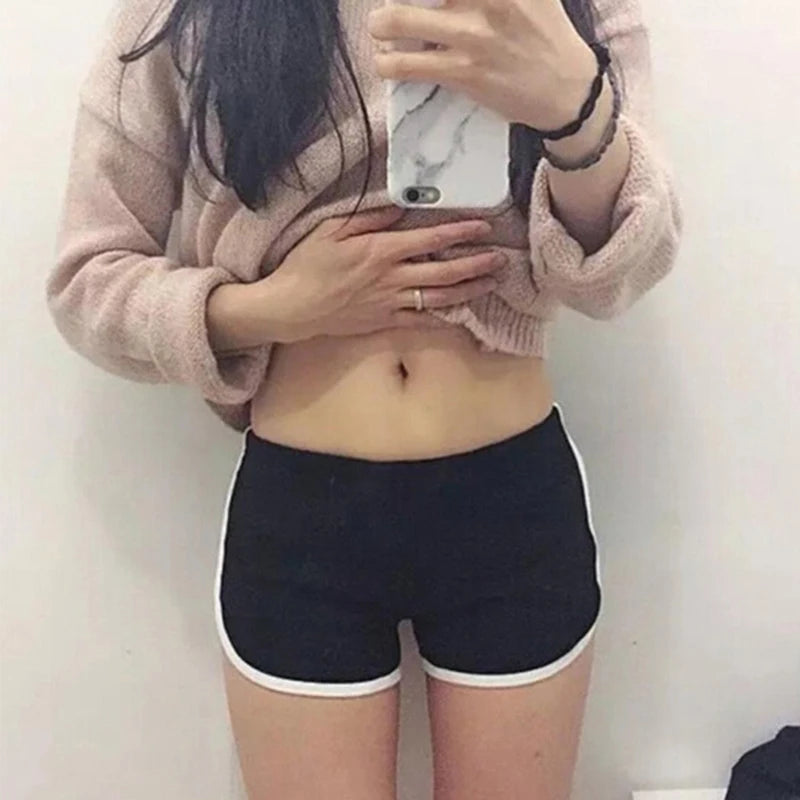 Skinny sports shorts black worn close up