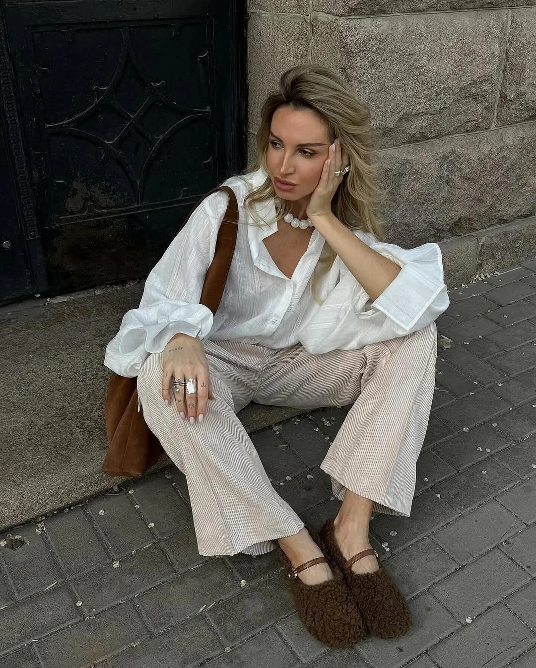 Women's oversized cotton button-up shirt worn as dress