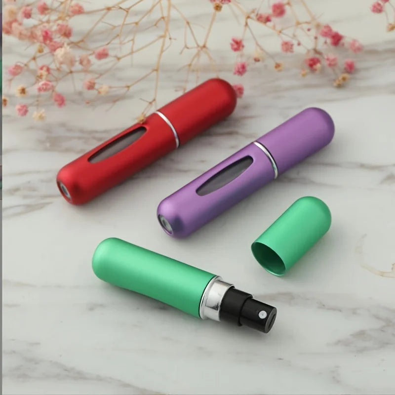 Mini Perfume Atomizer Bottles in silver, black, blue, and gold for stylish travel fragrance.