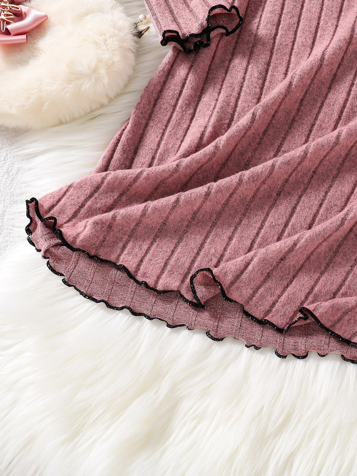 Girls knitted dress side view
