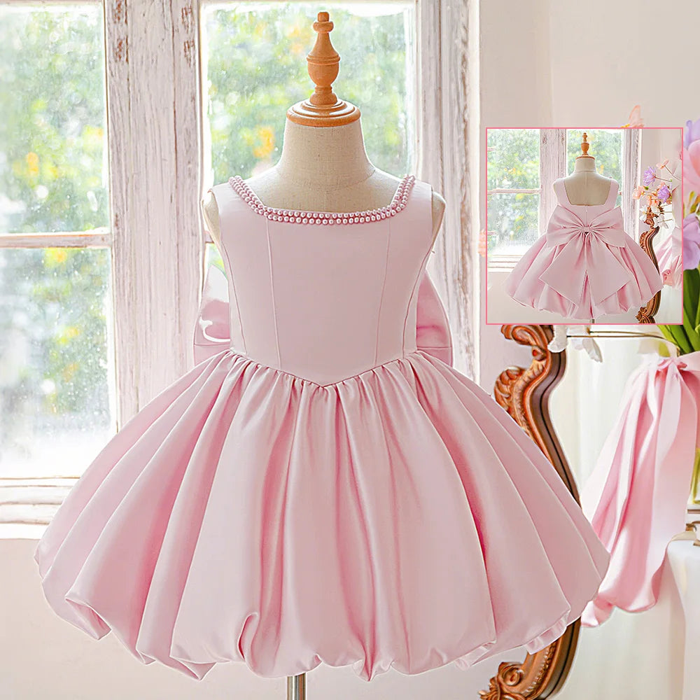Girls bow tutu party dress worn by child