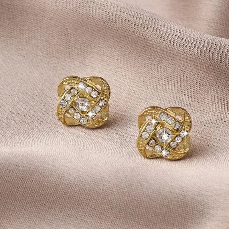 Zircon cross stud earrings worn on ear