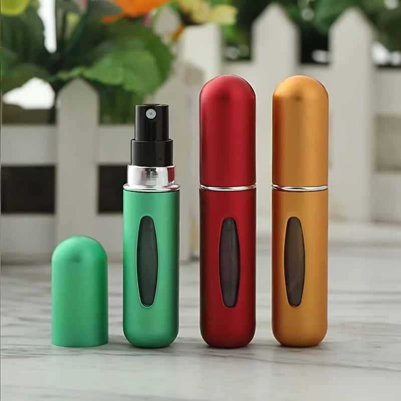 Mini Perfume Atomizer Bottles in silver, black, blue, and gold for stylish travel fragrance.