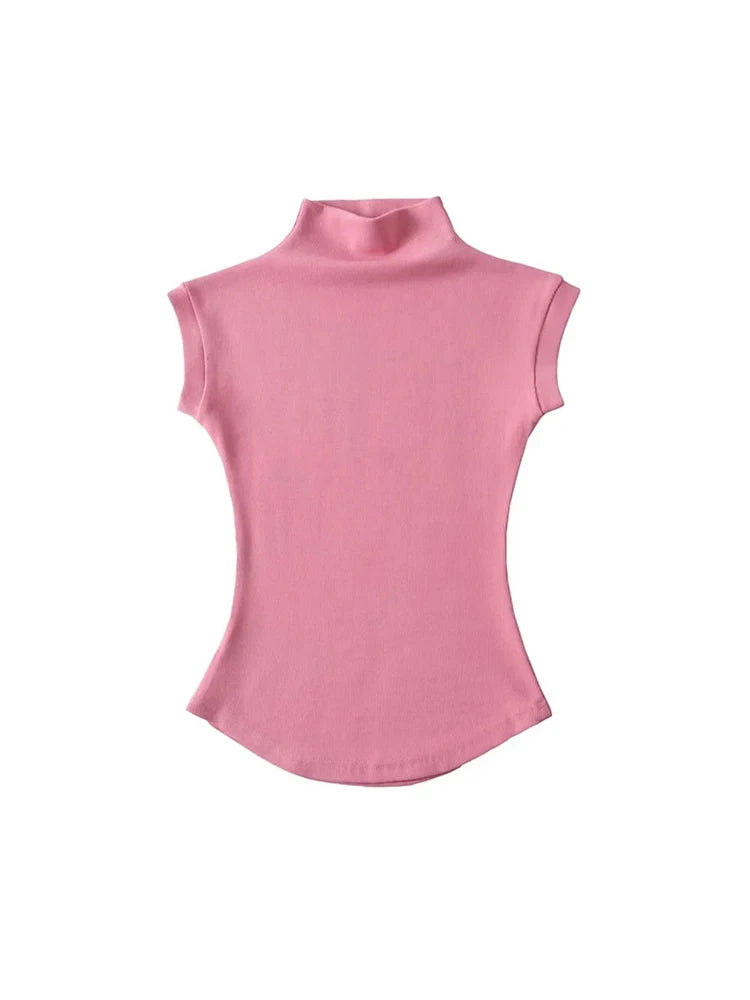 Sleeveless turtleneck top worn styled outfit