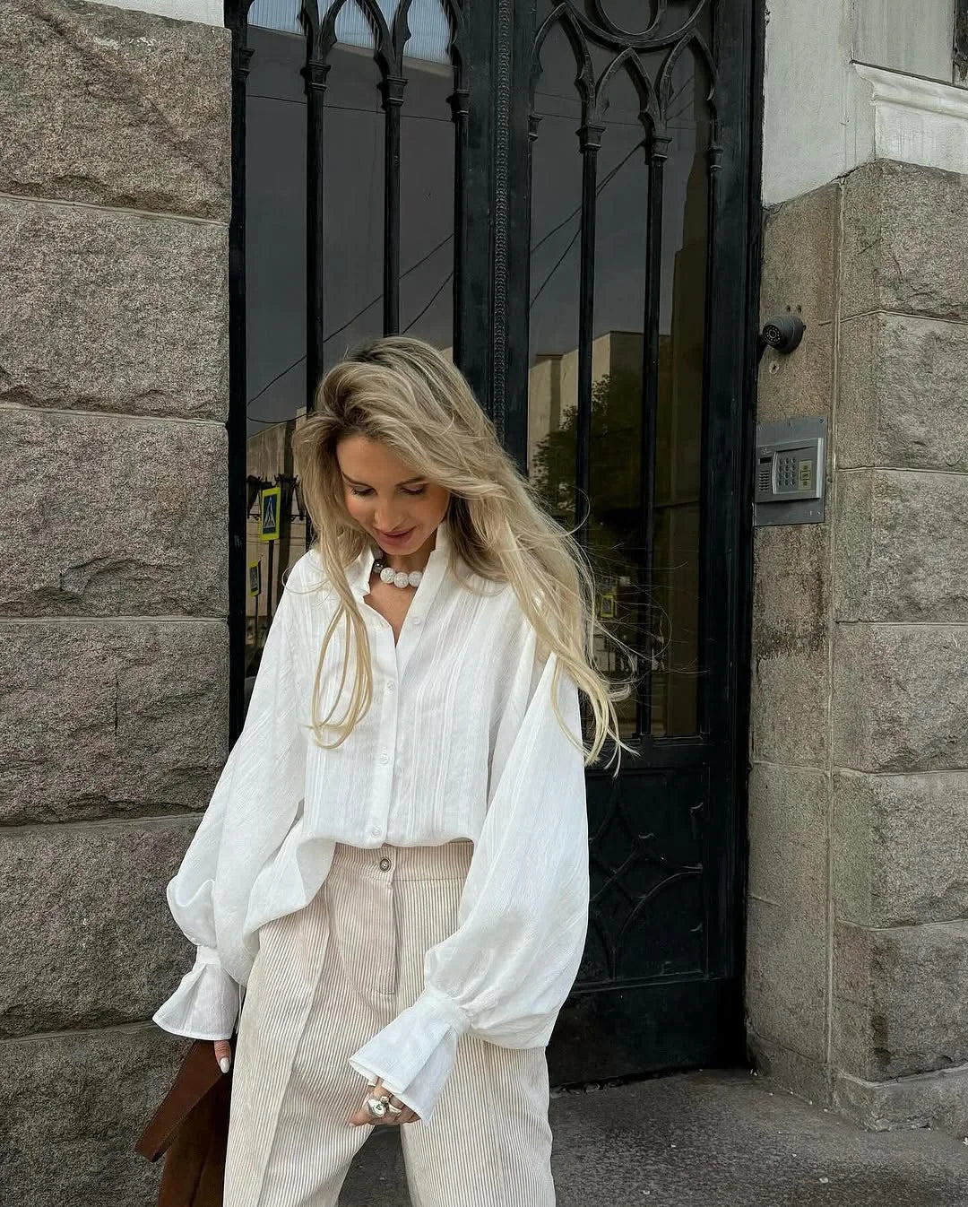 Women's oversized cotton button-up shirt worn as dress