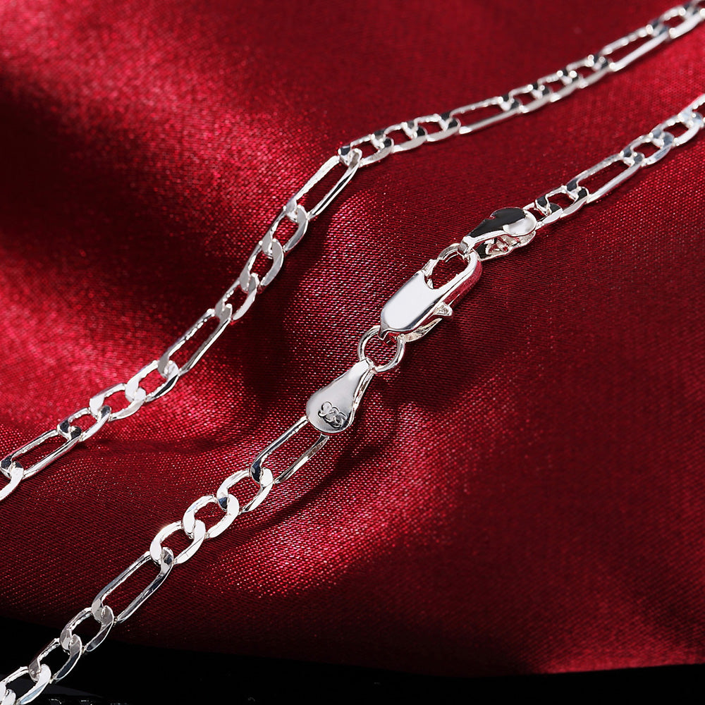 Silver chain bracelet & necklace set worn on neck
