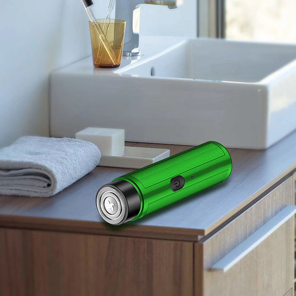 Mini Rechargeable Electric Shaver shown charging via USB port, highlighting travel-friendly design.