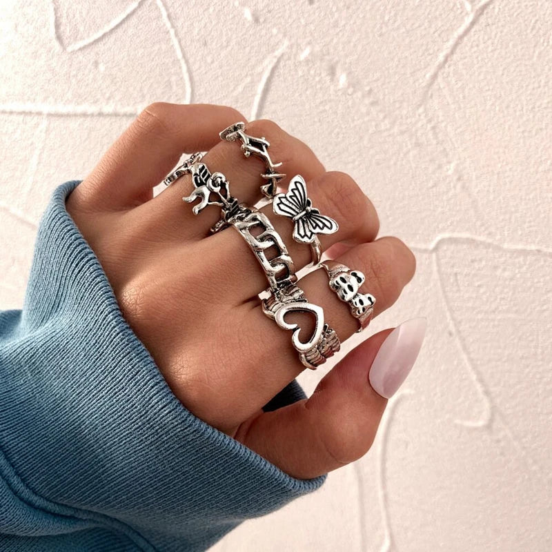 Assorted statement rings worn stacked on fingers