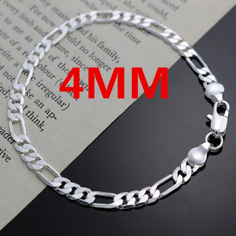 Silver chain bracelet & necklace set worn on neck