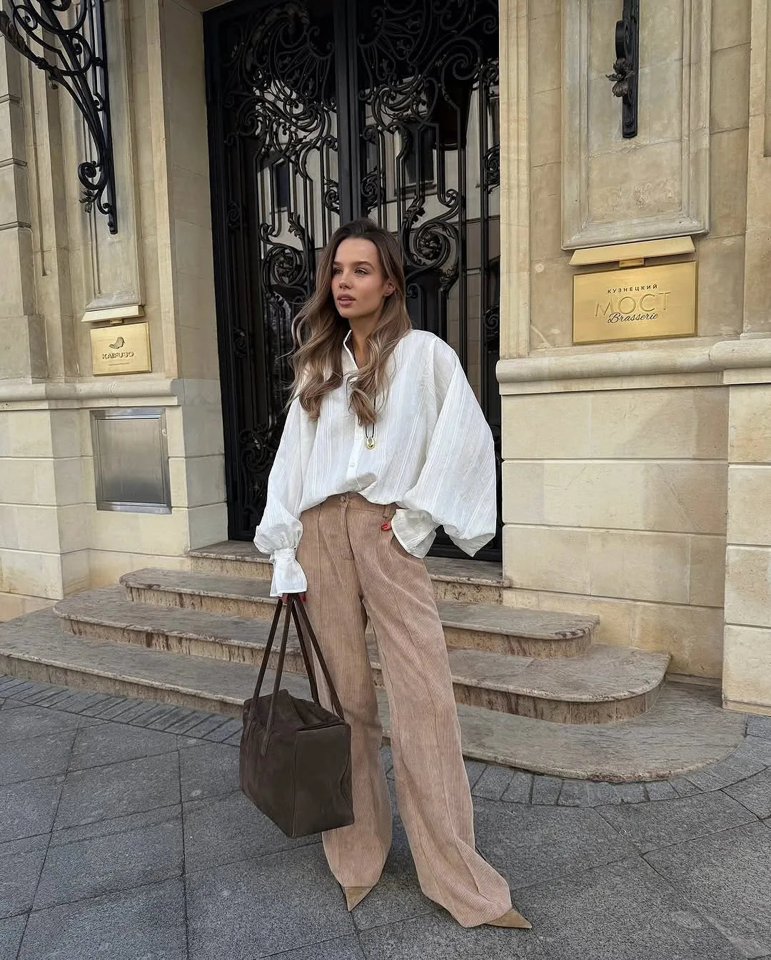 Women's oversized cotton button-up shirt worn as dress