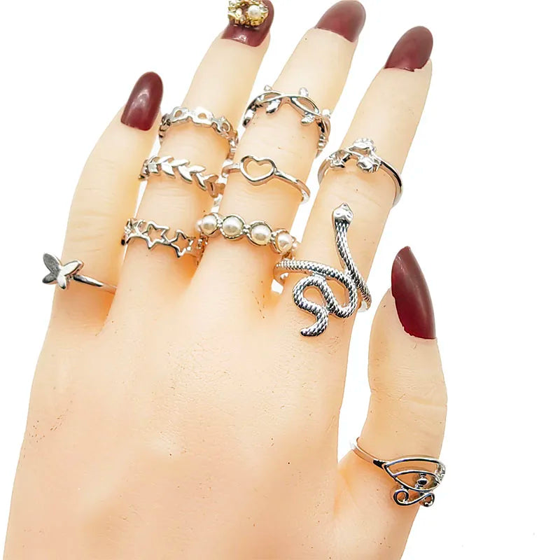 Assorted statement rings worn stacked on fingers