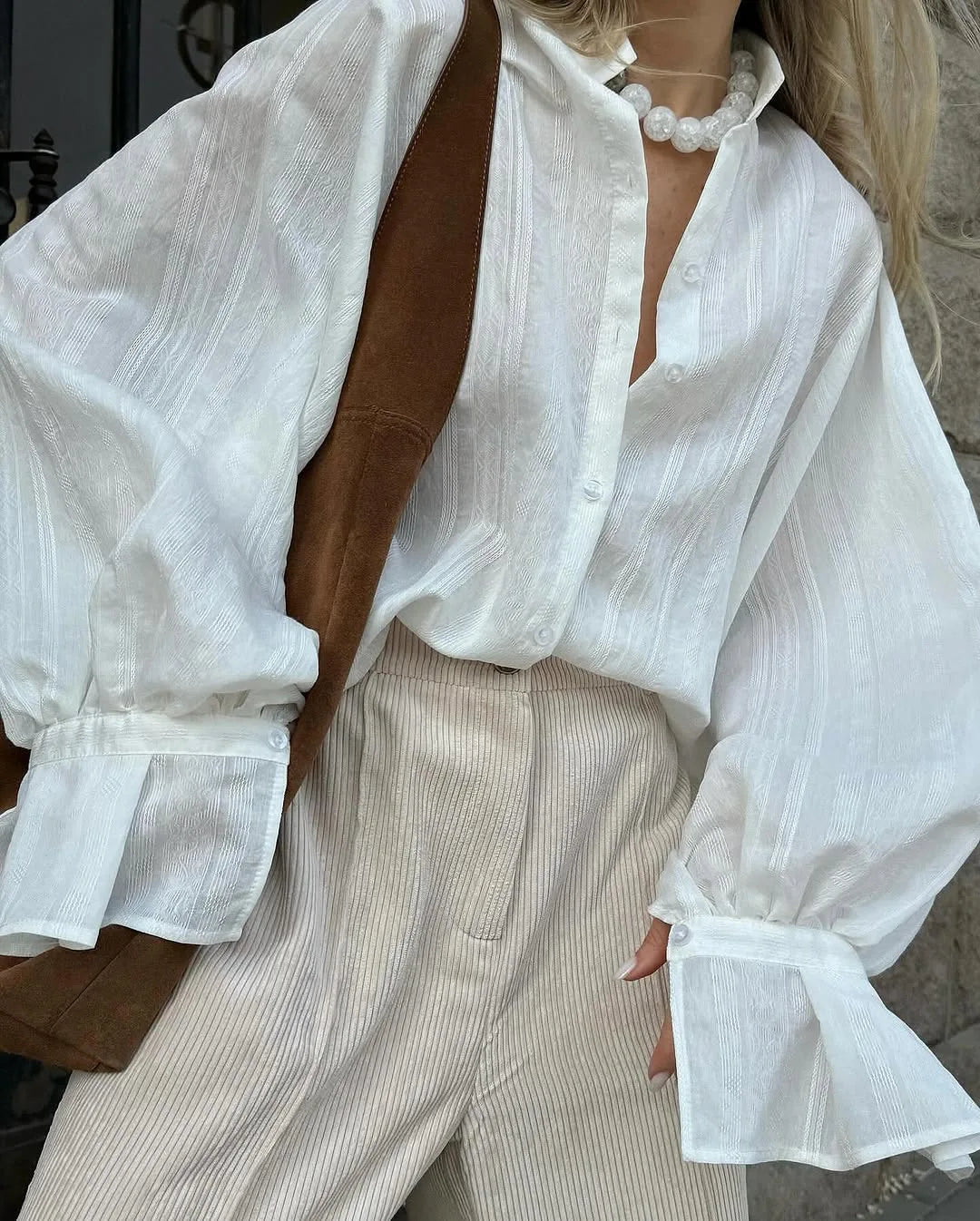 Women's oversized cotton button-up shirt worn as dress