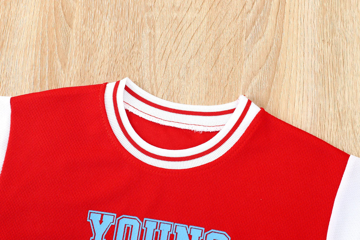 Boys basketball tee & shorts set worn by child