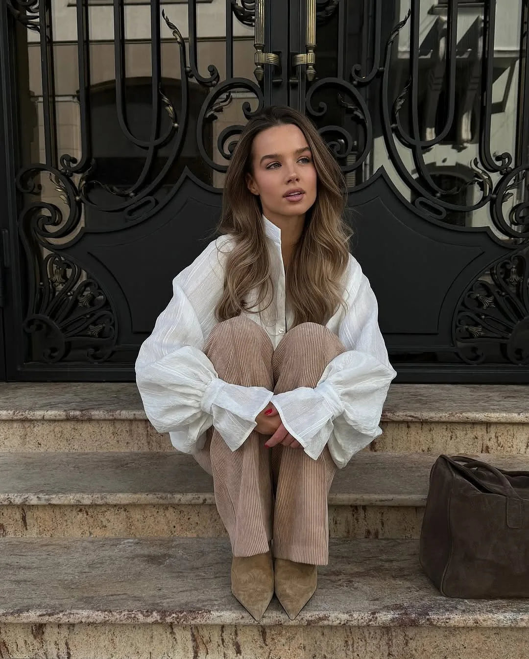 Women's oversized cotton button-up shirt worn as dress