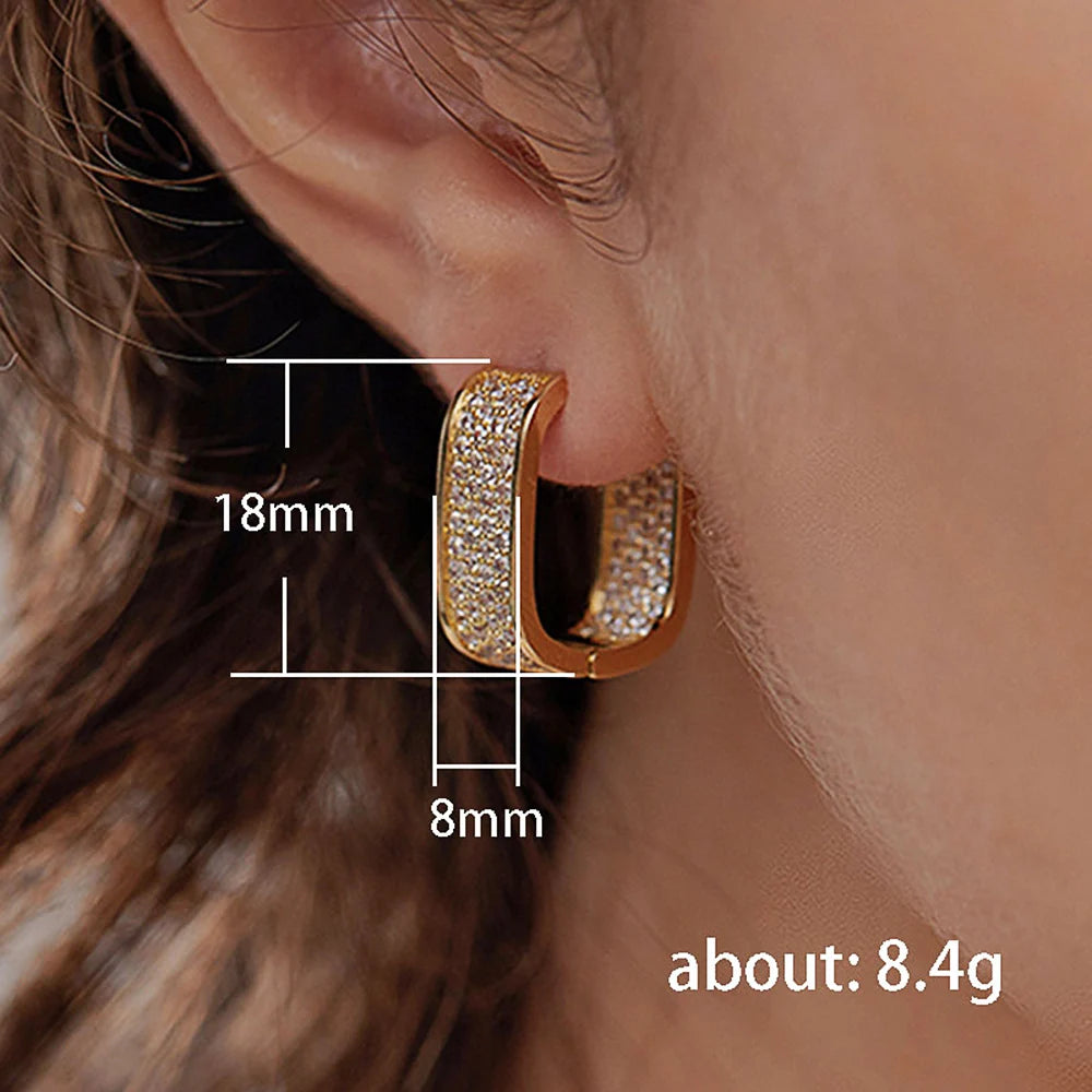 CZ paved hoop earrings worn on ear