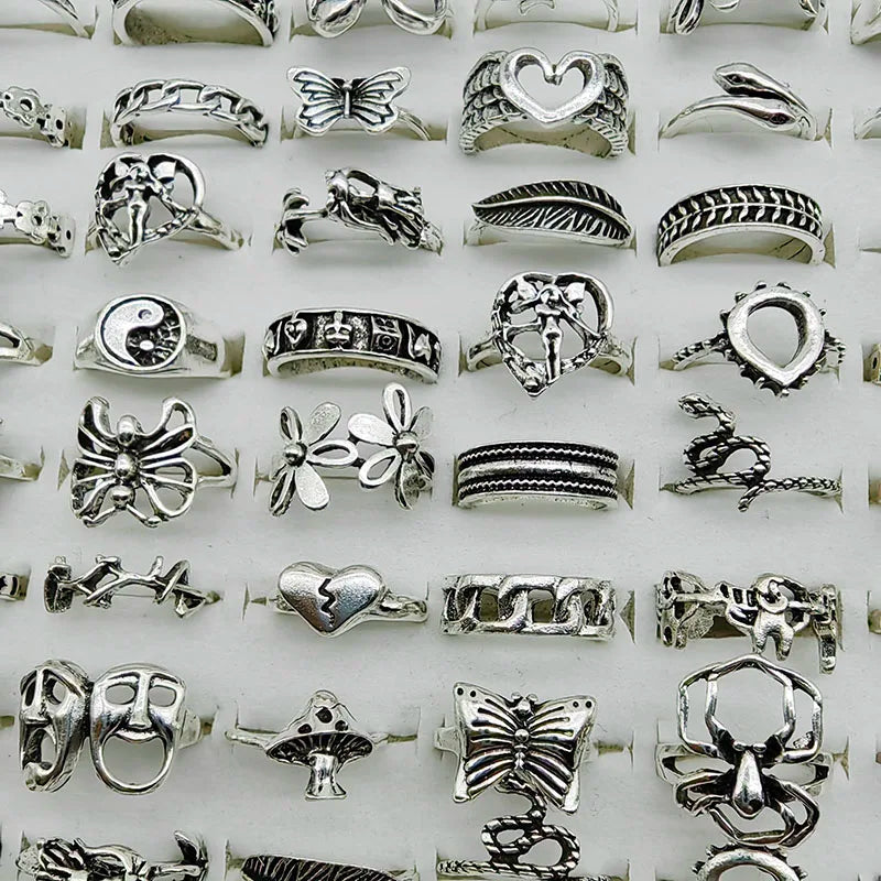 Assorted statement rings worn stacked on fingers