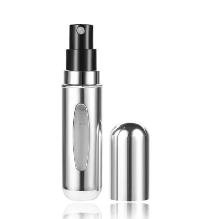 Mini travel perfume atomizer worn in use