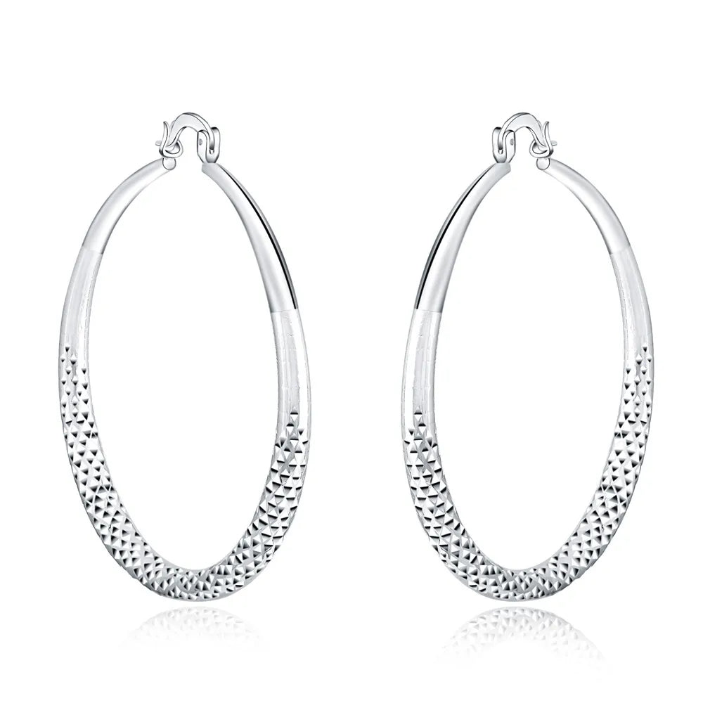 Small circle hoop earrings worn on ear