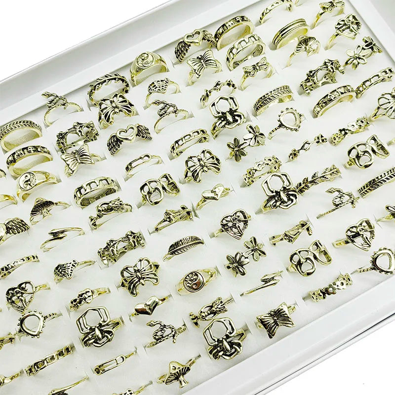 Assorted statement rings worn stacked on fingers