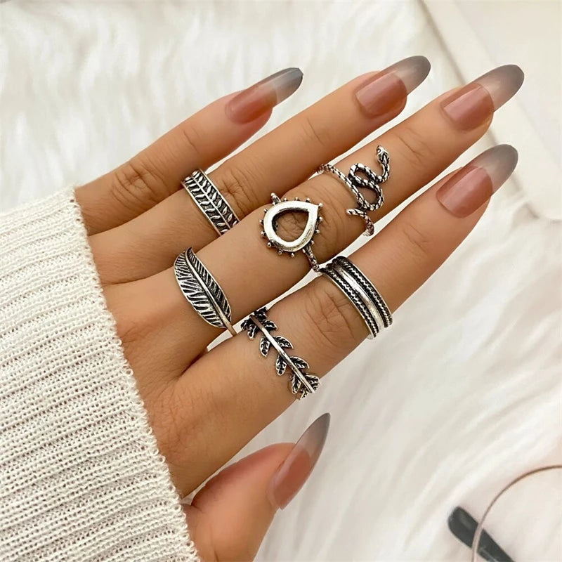 Assorted statement rings worn stacked on fingers