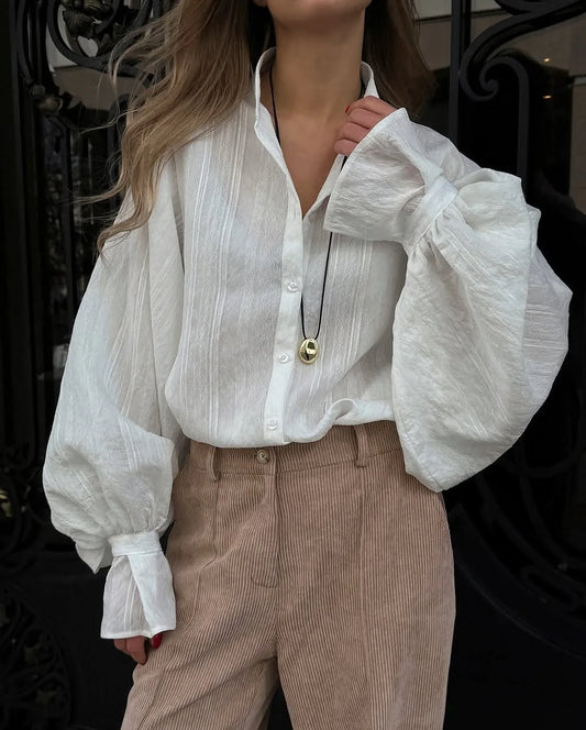 Women's oversized cotton button-up shirt worn as dress