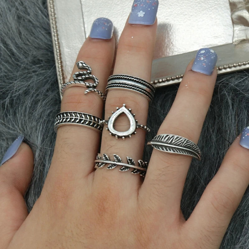 Assorted statement rings worn stacked on fingers