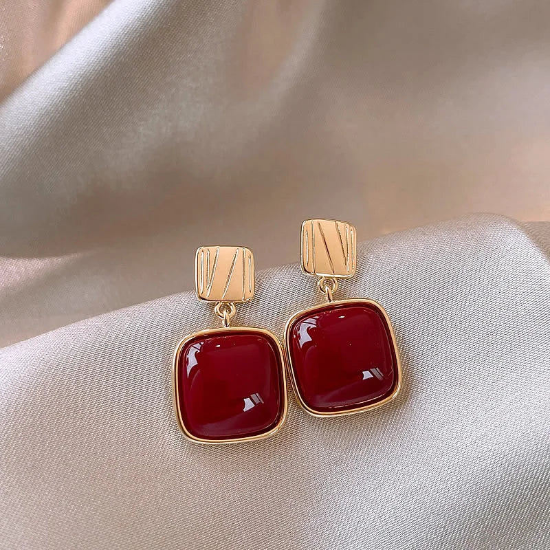 Zircon cross stud earrings worn on ear