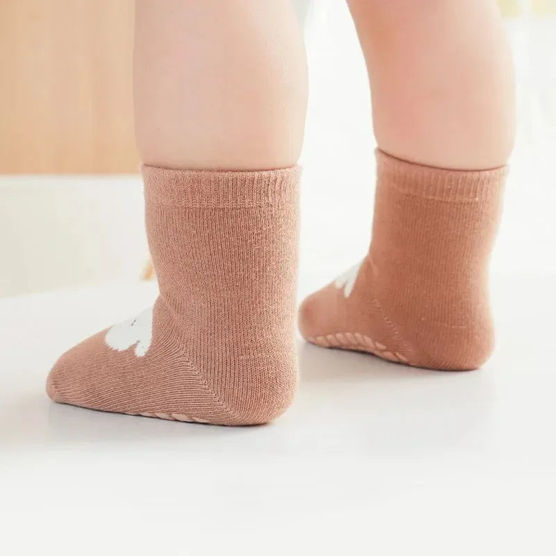 Kids non-slip socks worn on child feet