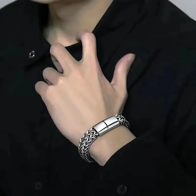 Braided stainless steel bracelet worn on wrist