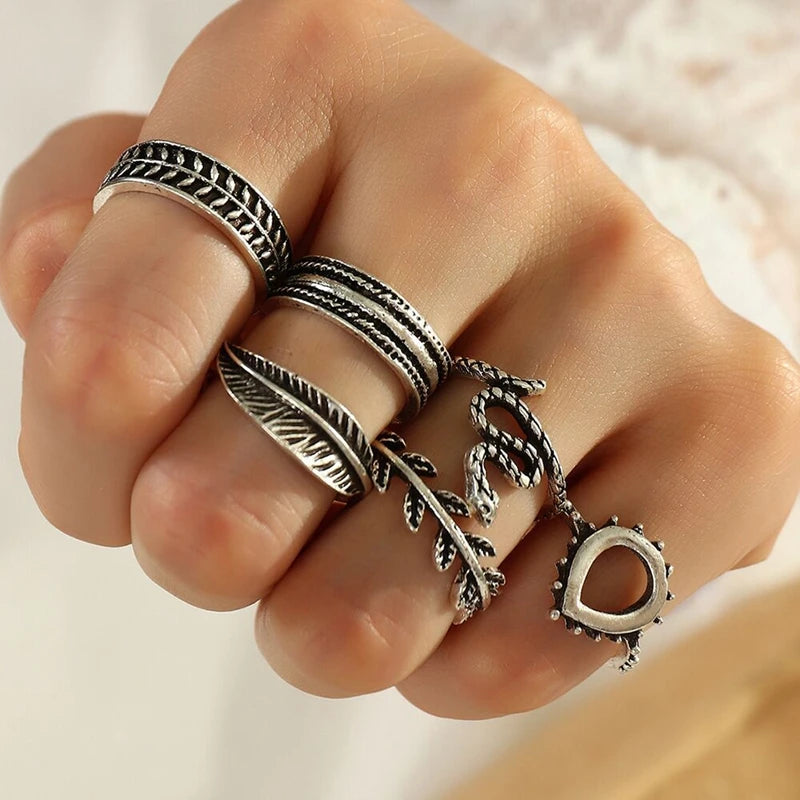 Assorted statement rings worn stacked on fingers
