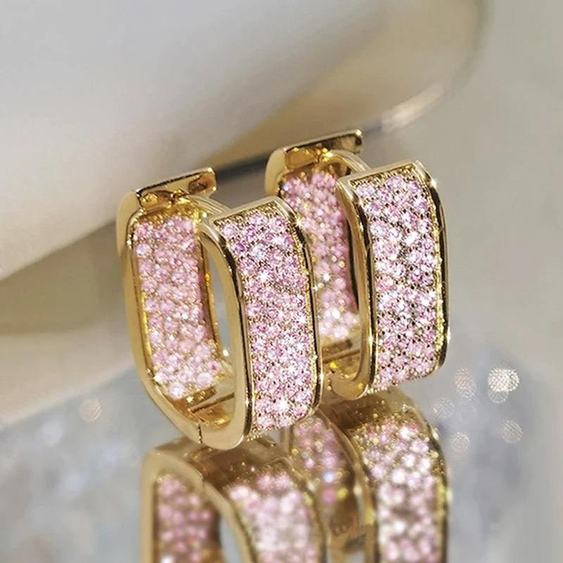 CZ paved hoop earrings worn on ear